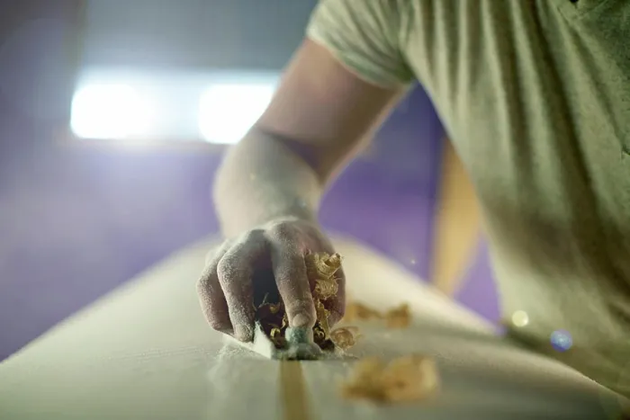 Framed Print : Manufacturing, hand and person with planer on surfboard for production process Framed Print : Manufacturing, hand and person with planer on surfboard for production process