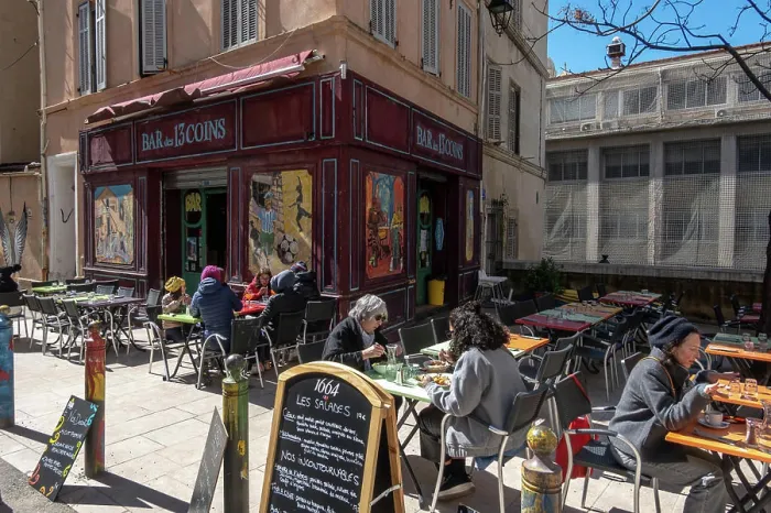 Framed Print : Marseille, France March 14, 2025 People sitting at an outdoor cafe in the Le Panier district Framed Print : Marseille, France March 14, 2025 People sitting at an outdoor cafe in the Le Panier district