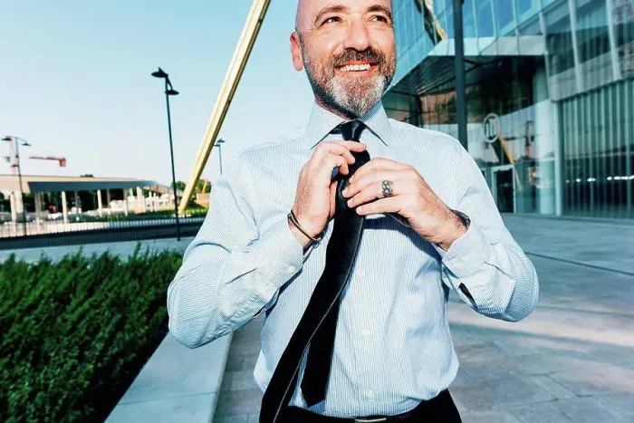 Framed Print : Mature businessman outdoors, straightening his tie Framed Print : Mature businessman outdoors, straightening his tie