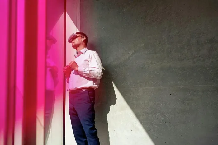Framed Print : Mature businessman watching through futuristic glasses in office