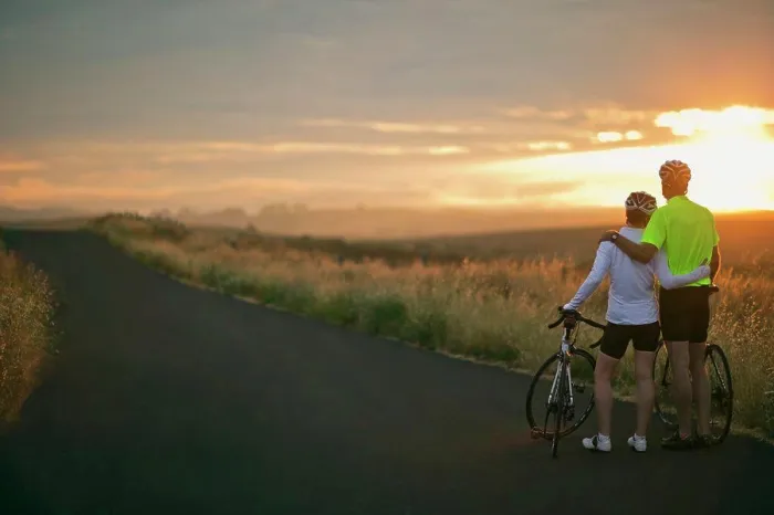 Framed Print : Mature couple embracing while watching the sunset over a rural landscape Framed Print : Mature couple embracing while watching the sunset over a rural landscape