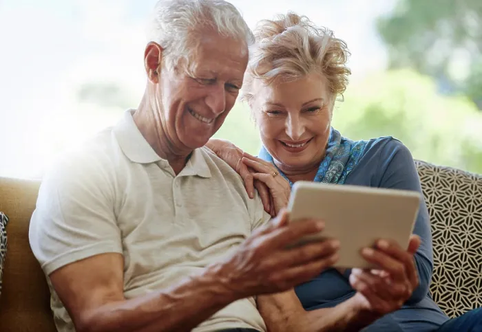 Framed Print : Mature couple, lounge and streaming with tablet Framed Print : Mature couple, lounge and streaming with tablet