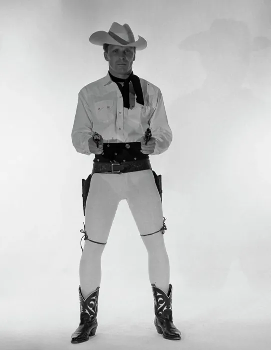 Framed Print : Mature cowboy holding guns Framed Print : Mature cowboy holding guns