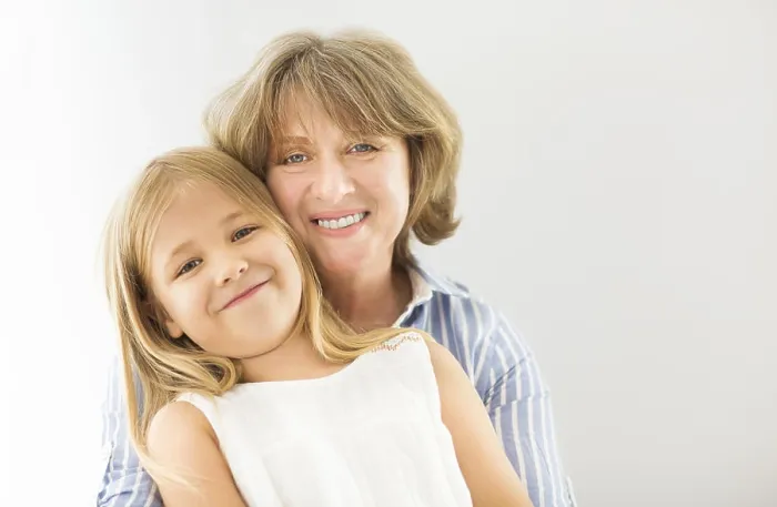 Framed Print : Mature woman embrace with young girl. Grandmother and girl Framed Print : Mature woman embrace with young girl. Grandmother and girl