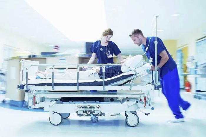 Framed Print : Two medics pushing gurney in hospital emergency room Framed Print : Two medics pushing gurney in hospital emergency room