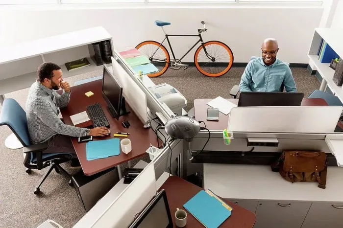 Framed Print : Men working at computers in office