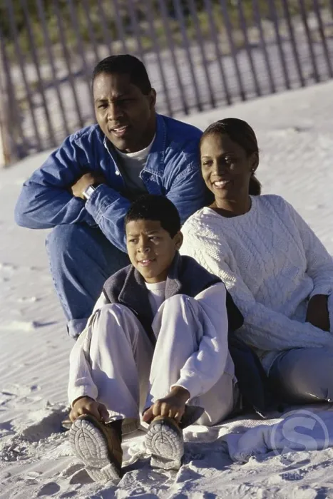 Framed Print : Mid adult couple on the beach with their son Framed Print : Mid adult couple on the beach with their son