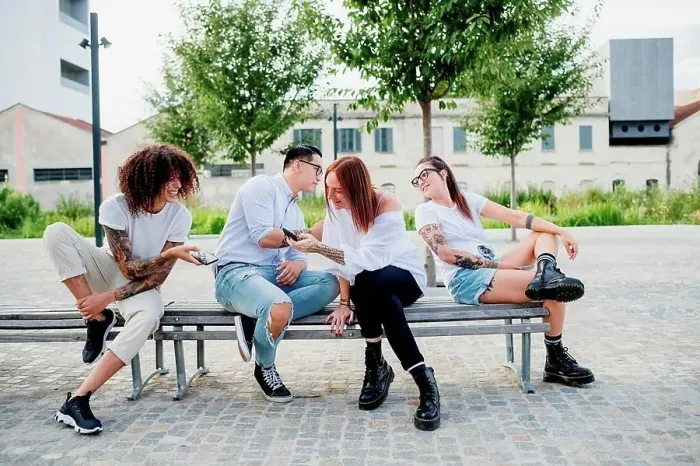 Framed Print : Mixed race group of friends hanging out together in town