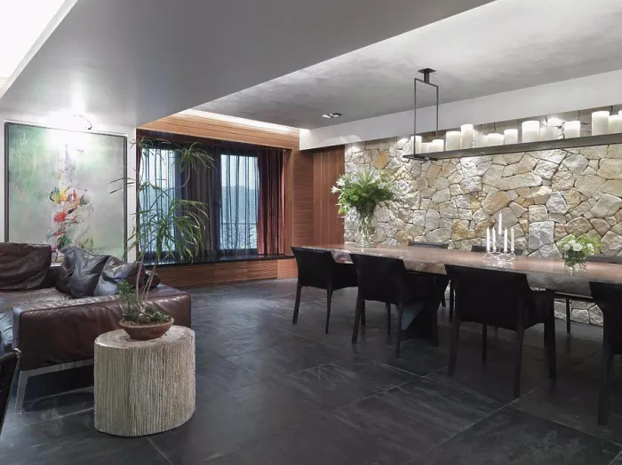 Framed Print : Modern great room with slate tile floor and a stone wall Framed Print : Modern great room with slate tile floor and a stone wall