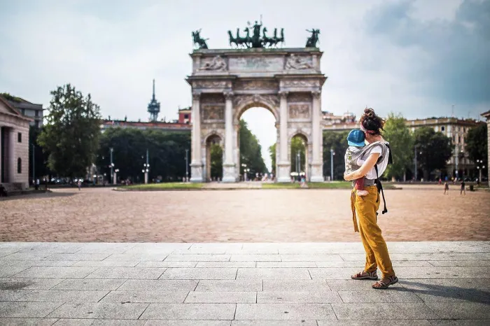 Framed Print : Mother carrying her baby visiting Milan