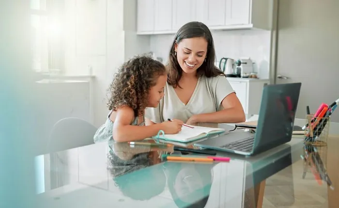 Framed Print : Mother helping her girl with writing her homework of a happy family house in her creative kids notebook