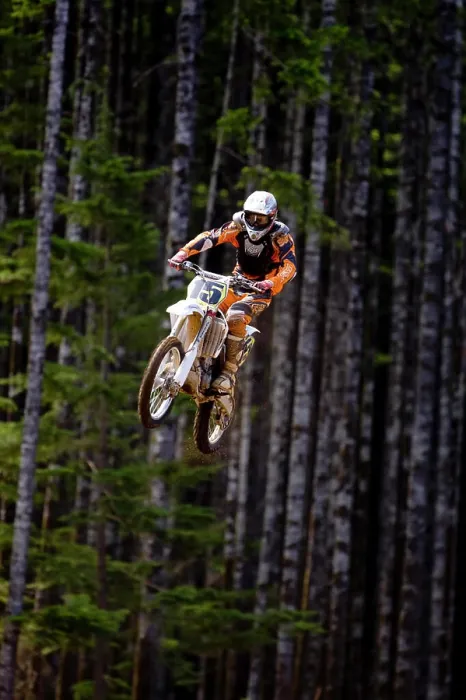 Framed Print : Motocross rider getting big air off of large double jump in motocross Race in Campbell River Framed Print : Motocross rider getting big air off of large double jump in motocross Race in Campbell River