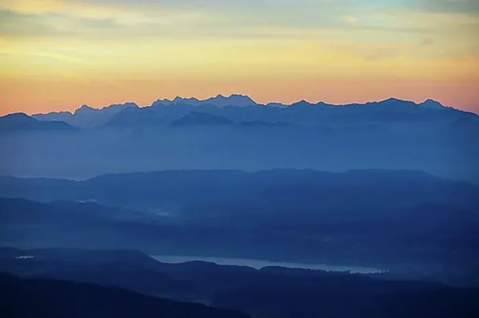 Framed Print : Mountain silhouette, mountains at dawn with a view of the Klagenfurt basin with Lake Lake Woerth and Karawanken Framed Print : Mountain silhouette, mountains at dawn with a view of the Klagenfurt basin with Lake Lake Woerth and Karawanken