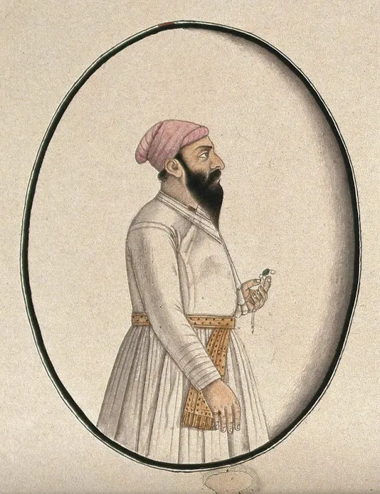 Framed Print : A Mughal courtier wearing a pink turban and holding an ornament (). Watercolour drawing by an Indian artist Framed Print : A Mughal courtier wearing a pink turban and holding an ornament (). Watercolour drawing by an Indian artist