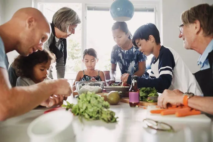 Framed Print : Multi-ethnic family preparing Asian food at kitchen Framed Print : Multi-ethnic family preparing Asian food at kitchen