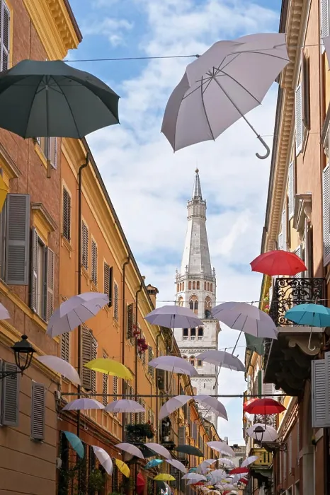 Framed Print : Multicolored umbrellas hanging in a narrow street in the center of Modena Framed Print : Multicolored umbrellas hanging in a narrow street in the center of Modena