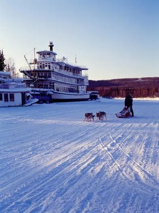 Framed Print : Musher Larry Dodge running his dogs down the frozen Chena River past the Riverboat Discovery III, Fairbanks, Alaska Framed Print : Musher Larry Dodge running his dogs down the frozen Chena River past the Riverboat Discovery III, Fairbanks, Alaska