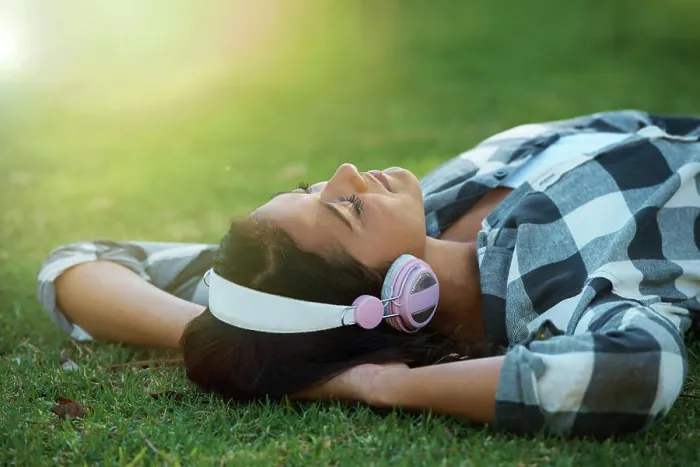 Framed Print : Music headphones, park or woman on lawn to relax for rest in garden Framed Print : Music headphones, park or woman on lawn to relax for rest in garden