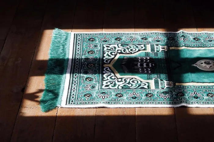 Framed Print : Muslim prayer mat at home. France. (Photo by: Pascal Deloche / Godong / UIG)