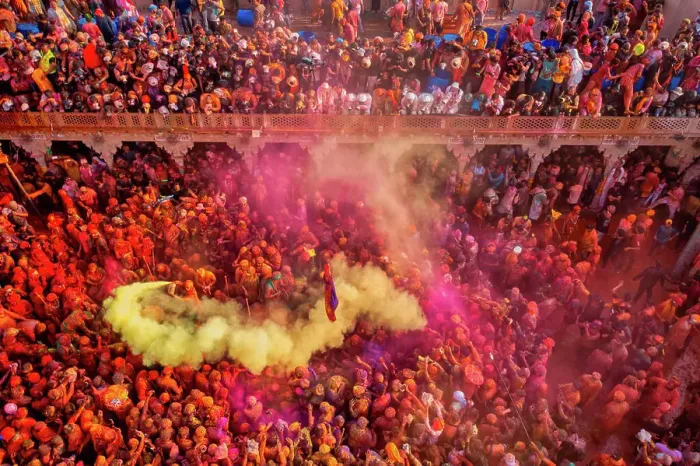 Framed Print : Nandgaon, India - 01 March 2023: Aerial view of people celebrating the holy colour festival at Shri And Baba Temple Framed Print : Nandgaon, India - 01 March 2023: Aerial view of people celebrating the holy colour festival at Shri And Baba Temple