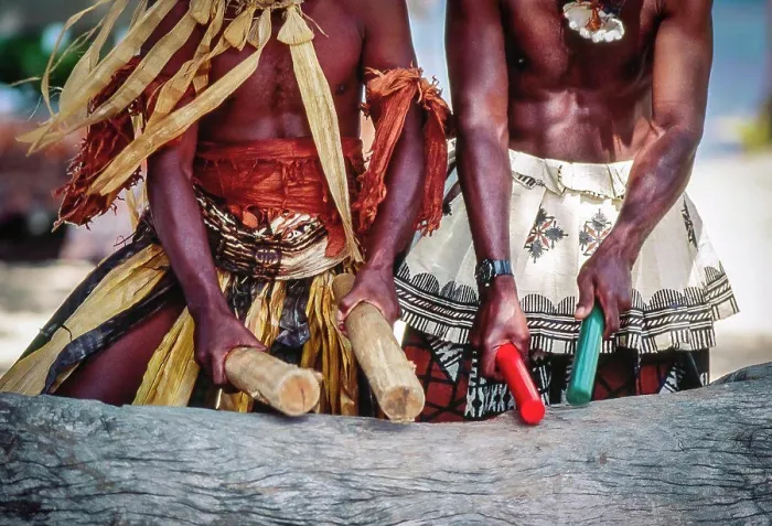 Framed Print : Two native Fijian men in traditional dress beating log ithe sticks making music Framed Print : Two native Fijian men in traditional dress beating log ithe sticks making music