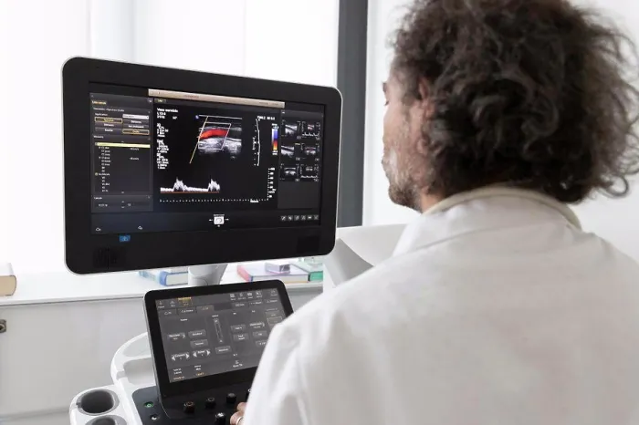 Framed Print : a neurologist gives an ultrasound to a patient Framed Print : a neurologist gives an ultrasound to a patient