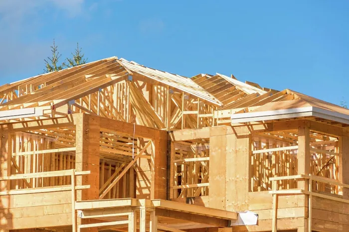 Framed Print : New apartment building under construction on sunny day on blue sky background