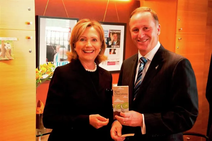 Framed Print : New Zealand Prime Minister John Key displays a Kiwi Chocolava bar beside U Framed Print : New Zealand Prime Minister John Key displays a Kiwi Chocolava bar beside U