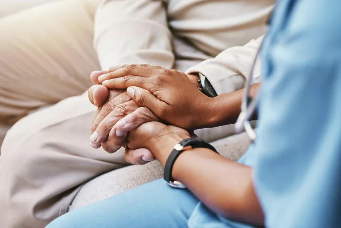 Framed Print : Nurse holding hands with patient in empathy Framed Print : Nurse holding hands with patient in empathy