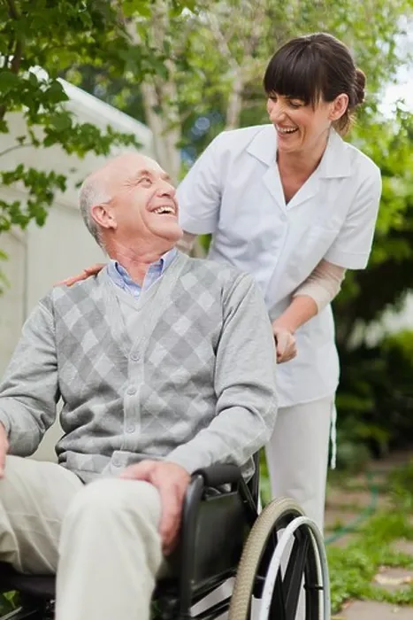 Framed Print : Nurse wheeling older patient outdoors Framed Print : Nurse wheeling older patient outdoors