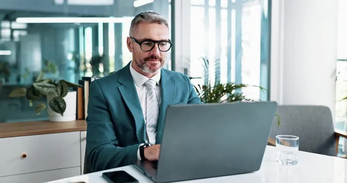 Framed Print : Office, mature and businessman with laptop for reading Framed Print : Office, mature and businessman with laptop for reading