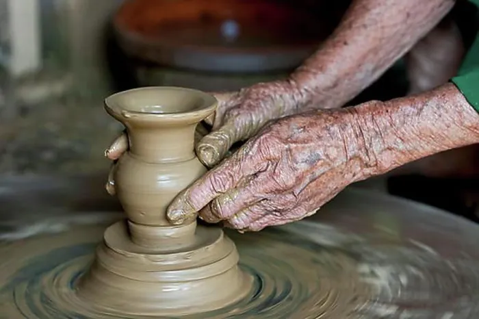 Framed Print : Old hands making pottery Framed Print : Old hands making pottery