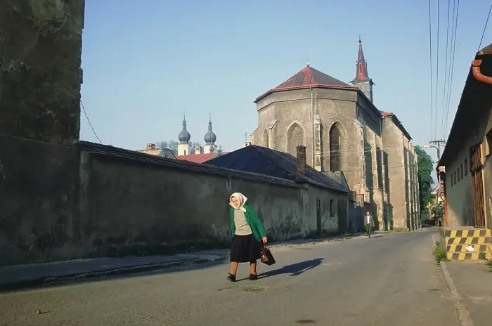 Framed Print : Old woman walking on a down street Framed Print : Old woman walking on a down street
