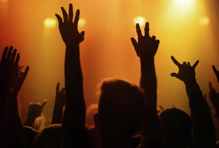 Framed Print : Orange lights, hands of people at concert or music festival dancing with energy in silhouette at live event Framed Print : Orange lights, hands of people at concert or music festival dancing with energy in silhouette at live event