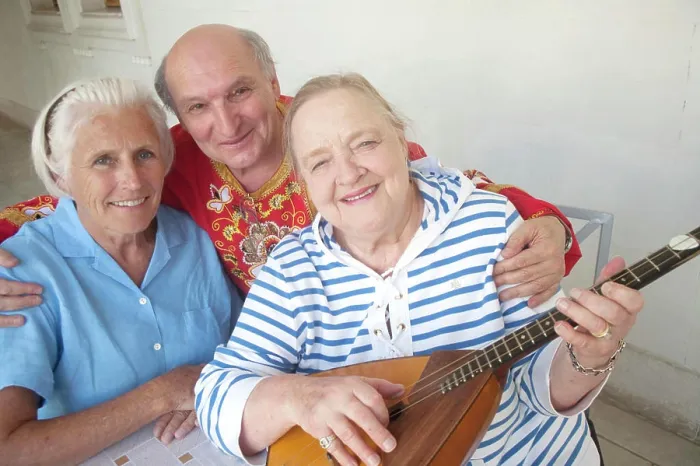 Framed Print : Overseas visitors with musician in folk attire become best friends at a concert in the Inner Gardens of the Livadia Framed Print : Overseas visitors with musician in folk attire become best friends at a concert in the Inner Gardens of the Livadia