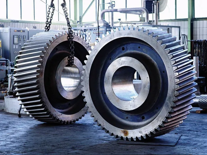 Framed Print : A pair of giant gear wheels in factory which produces gears