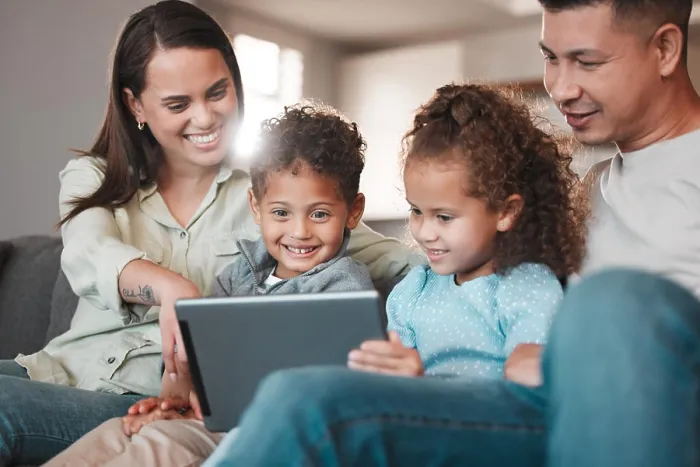 Framed Print : Parents, happy kids and tablet for movies in home Framed Print : Parents, happy kids and tablet for movies in home