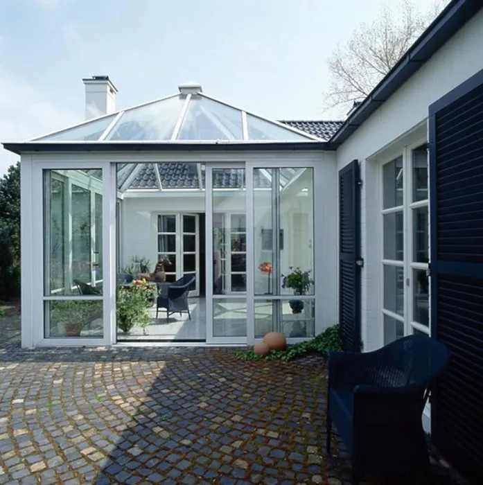 Framed Print : Paving setts in front of conservatory extension on modern white house Framed Print : Paving setts in front of conservatory extension on modern white house