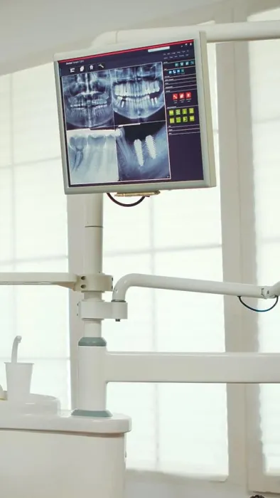 Framed Print : Pediatric dentist showing on monitor teeth x-ray Framed Print : Pediatric dentist showing on monitor teeth x-ray