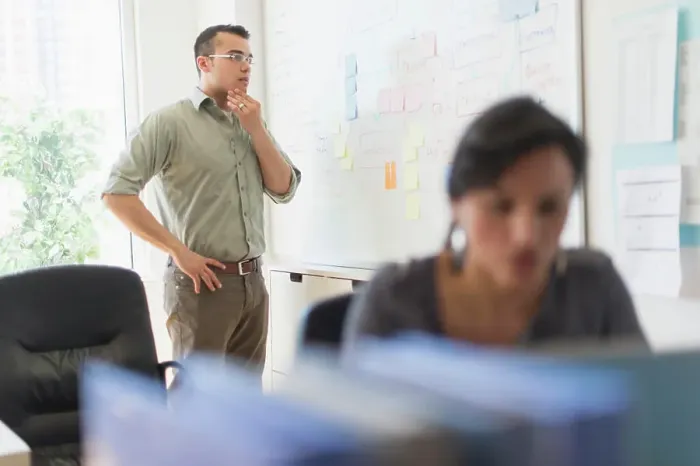 Framed Print : Two people working in office