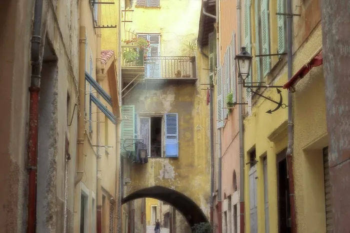 Framed Print : Person in an alley between houses, Villefranche-Sur-Mer, France Framed Print : Person in an alley between houses, Villefranche-Sur-Mer, France