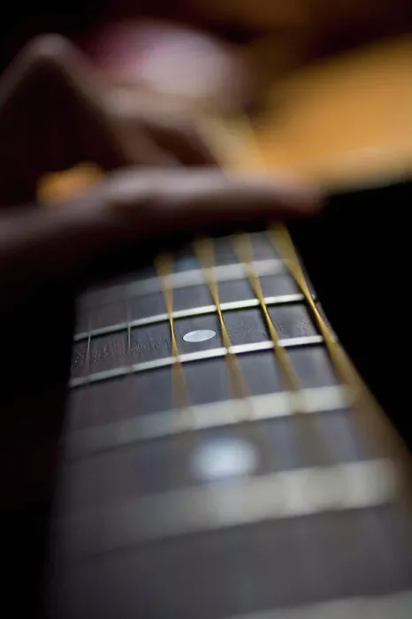 Framed Print : Detail of a person playing an acoustic guitar Framed Print : Detail of a person playing an acoustic guitar