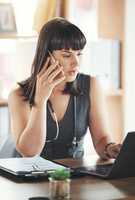 Framed Print : Phone call, woman and doctor on laptop
