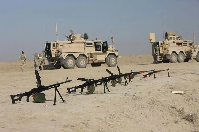 Framed Print : PK 7.62 mm general-purpose machine guns and RPK Kalashnikov rifles sit ready on a firing range in Kunduz, Afghanistan Framed Print : PK 7.62 mm general-purpose machine guns and RPK Kalashnikov rifles sit ready on a firing range in Kunduz, Afghanistan