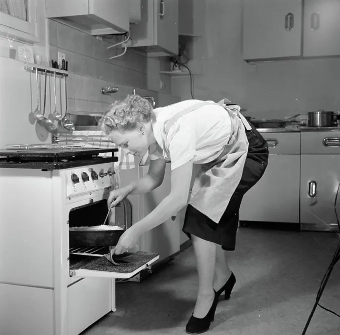Framed Print : Poll photo collection. Advertising photography. Housewife in model kitchen busy making a cake.. June 1, 1953 Framed Print : Poll photo collection. Advertising photography. Housewife in model kitchen busy making a cake.. June 1, 1953