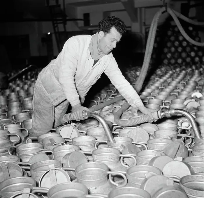 Framed Print : Poll photo collection. Report Paris. Milk factory: Man fills the milk buses. 1950. France, Paris Framed Print : Poll photo collection. Report Paris. Milk factory: Man fills the milk buses. 1950. France, Paris