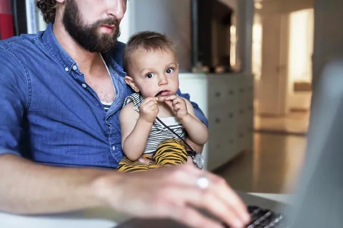 Framed Print : Portrait of baby boy with father using laptop at home Framed Print : Portrait of baby boy with father using laptop at home