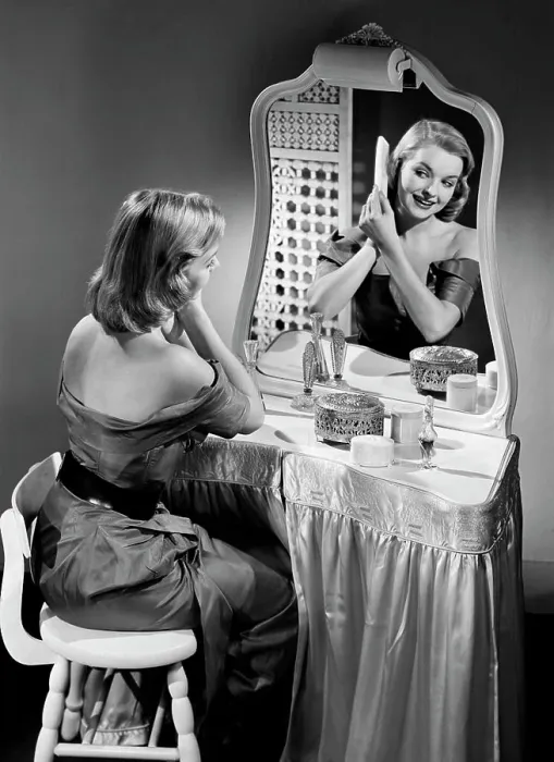 Framed Print : Portrait of beautiful woman combing hair in front of mirror Framed Print : Portrait of beautiful woman combing hair in front of mirror