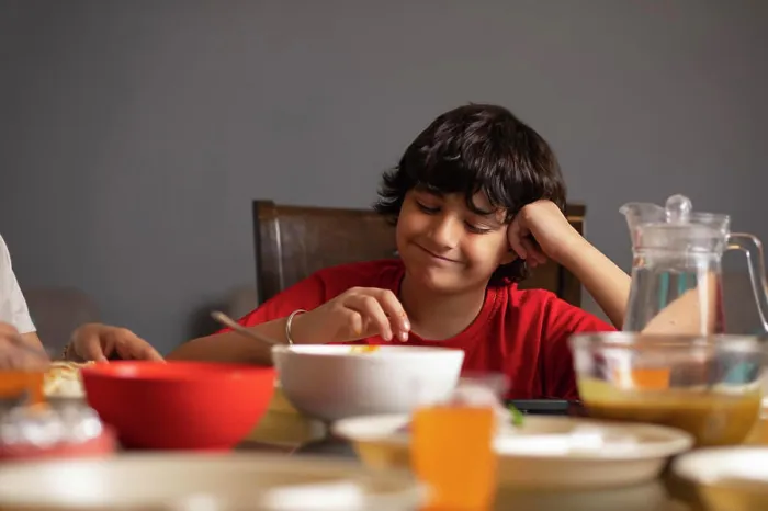 Framed Print : Portrait of boy having lunch at home Framed Print : Portrait of boy having lunch at home