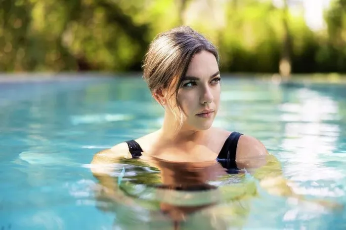 Framed Print : Portrait or caucasian woman floating in swimming pool in backyard Framed Print : Portrait or caucasian woman floating in swimming pool in backyard